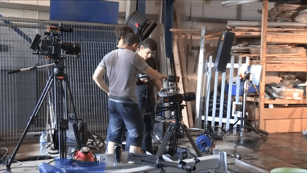 High-quality filmmaking in progress with professional camera setup in a workshop environment.