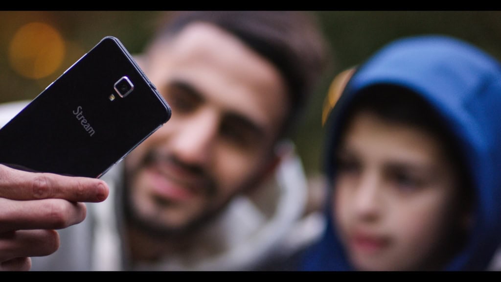 Stream video recording on mobile device, people watching and sharing content, film division and video production services.