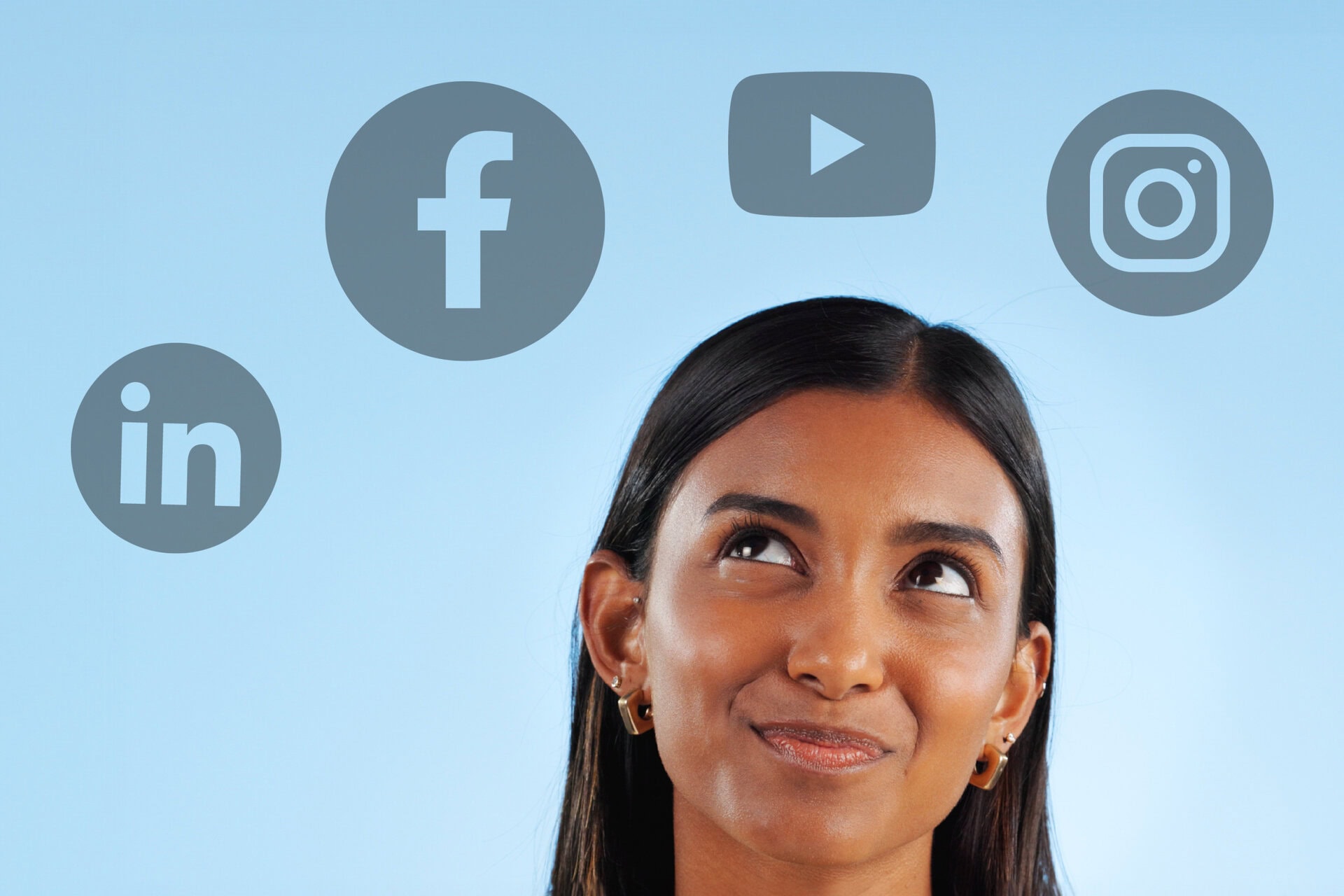 Social media icons over a woman's head, demonstrating digital marketing and social media strategy.