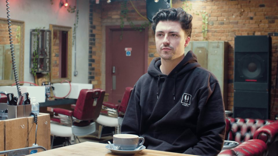 Creative film production studio with behind-the-scenes setting in brick-walled space.