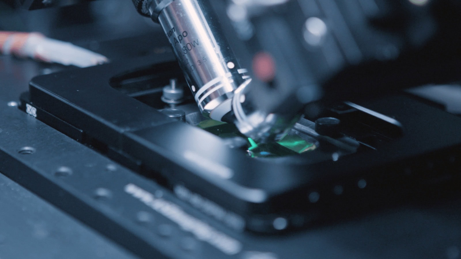 High-tech microscope inspecting electronic circuit board at Film Division for innovative film production.