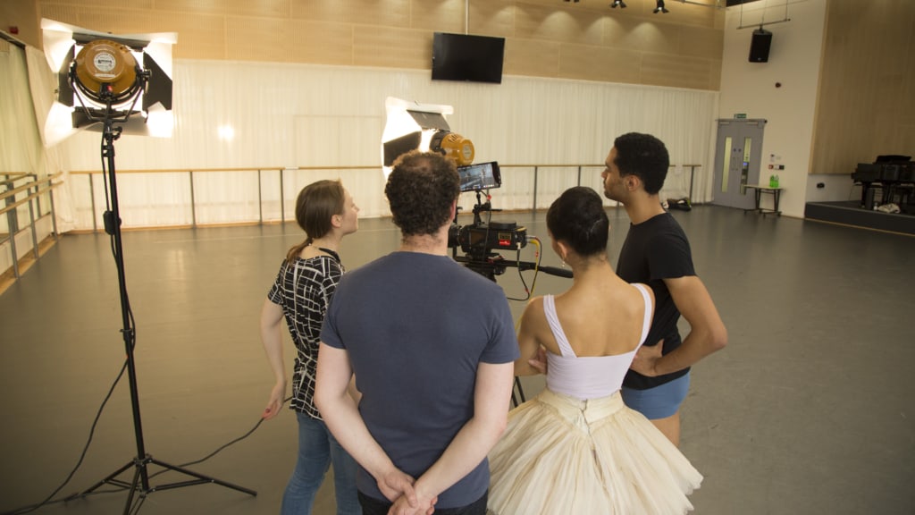 High-quality film production crew working with professional camera equipment in a studio setting.