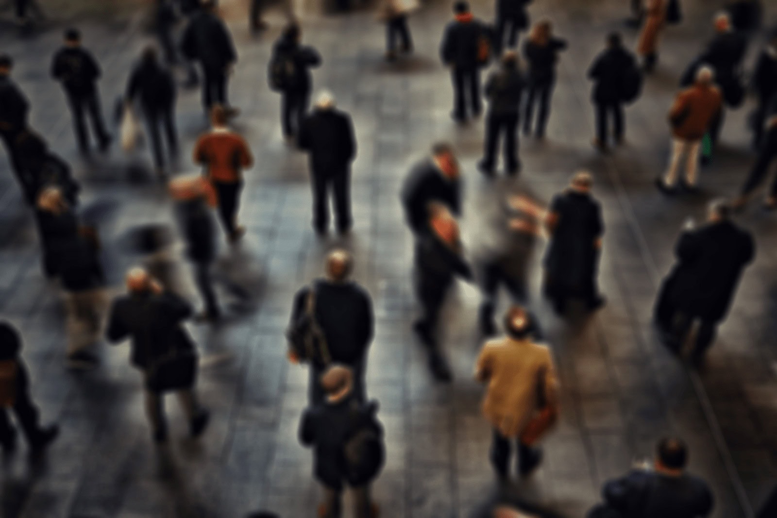 Crowd of business people walking in a modern public space, captured from above, representing corporate environment and urban life.
