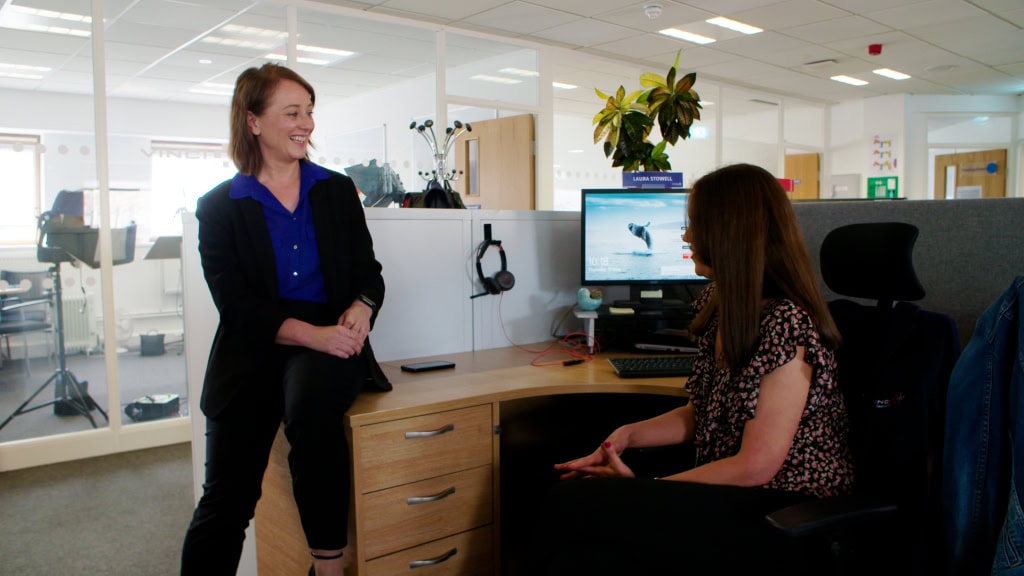 Creative team collaboration in modern office environment for professional video production. Audience Value