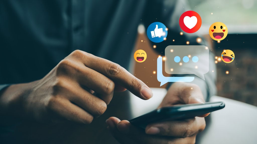 Mobile phone with social media emojis and chat icons falling, representing digital communication and social media engagement.